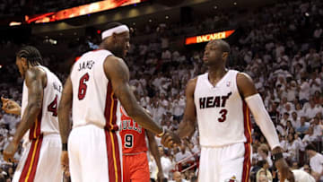 LeBron James #6 and Dwyane Wade #3 of the Miami Heat react against the Chicago Bulls (Photo by Mike Ehrmann/Getty Images)