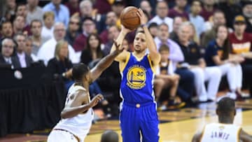 Jun 8, 2016; Cleveland, OH, USA; Golden State Warriors guard Stephen Curry (30) shoots the ball over Cleveland Cavaliers center Tristan Thompson (13) during the first half in game three of the NBA Finals at Quicken Loans Arena. Mandatory Credit: David Richard-USA TODAY Sports