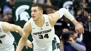 Jan 31, 2016; East Lansing, MI, USA; Michigan State Spartans forward Gavin Schilling (34) brings the ball up court against the Rutgers Scarlet Knights during the second half of a game at Jack Breslin Student Events Center. Mandatory Credit: Mike Carter-USA TODAY Sports