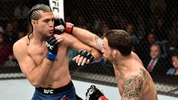 LAS VEGAS, NV - MARCH 03: (R-L) Frankie Edgar punches Brian Ortega in their featherweight bout during the UFC 222 event inside T-Mobile Arena on March 3, 2018 in Las Vegas, Nevada. (Photo by Jeff Bottari/Zuffa LLC/Zuffa LLC via Getty Images)