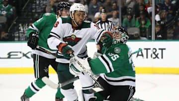 DALLAS, TX - SEPTEMBER 24: Jordan Greenway #18 of the Minnesota Wild skates into Anton Khudobin #35 of the Dallas Stars during a preseason game at American Airlines Center on September 24, 2018 in Dallas, Texas. (Photo by Ronald Martinez/Getty Images)