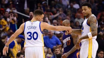 Feb 10, 2016; Phoenix, AZ, USA; Golden State Warriors guard Stephen Curry (30) is congratulated by forward Brandon Rush (4) in the game against the Golden State Warriors at Talking Stick Resort Arena. Mandatory Credit: Jennifer Stewart-USA TODAY Sports