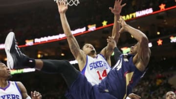Jan 16, 2015; Philadelphia, PA, USA; New Orleans Pelicans forward Dante Cunningham (44) drives the basket and collides with Philadelphia 76ers guard K.J. McDaniels (14) during the second half at Wells Fargo Center. The 76ers defeated the Pelicans 96-81. Mandatory Credit: Bill Streicher-USA TODAY Sports
