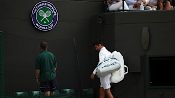 LONDON, ENGLAND - JULY 12: Novak Djokovic of Serbia leaves court as he retires injured during the Gentlemen's Singles quarter final match against Tomas Berdych of The Czech Republic on day nine of the Wimbledon Lawn Tennis Championships at the All England Lawn Tennis and Croquet Club on July 12, 2017 in London, England. (Photo by Julian Finney/Getty Images)