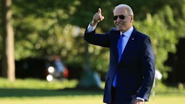 WASHINGTON, DC - JUNE 25: U.S. President Joe Biden points to staff members from the South Lawn as he departs the White House on June 25, 2021 in Washington, DC. Biden is scheduled to spend the weekend at Camp David. (Photo by Chip Somodevilla/Getty Images)