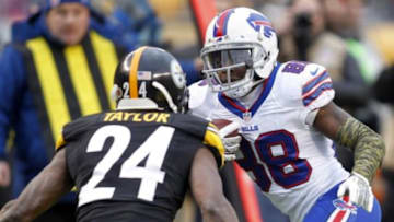 Nov 10, 2013; Pittsburgh, PA, USA; Buffalo Bills wide receiver Marquise Goodwin (88) runs after a pass reception as Pittsburgh Steelers cornerback Ike Taylor (24) defends during the fourth quarter at Heinz Field. The Pittsburgh Steelers won 23-10. Mandatory Credit: Charles LeClaire-USA TODAY Sports