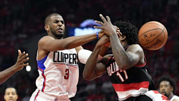 Apr 17, 2016; Los Angeles, CA, USA; Los Angeles Clippers guard Chris Paul (3) and Portland Trail Blazers center Ed Davis (17) go after the ball during the first half in game one of the first round of the NBA Playoffs at Staples Center. Mandatory Credit: Richard Mackson-USA TODAY Sports