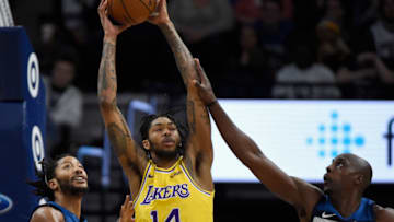 MINNEAPOLIS, MN - OCTOBER 29: Isaac Bonga #17 of the Los Angeles Lakers grabs a rebounds against Derrick Rose #25 and Anthony Tolliver #43 of the Minnesota Timberwolves during the fourth quarter of the game on October 29, 2018 at the Target Center in Minneapolis, Minnesota. The Timberwolves defeated the Lakers 124-120. NOTE TO USER: User expressly acknowledges and agrees that, by downloading and or using this Photograph, user is consenting to the terms and conditions of the Getty Images License Agreement. (Photo by Hannah Foslien/Getty Images)