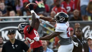 Aug 1, 2014; Lawrenceville, GA, USA; Atlanta Falcons wide receiver Harry Douglas (83) catches a pass against cornerback Robert Alford (23) during practice during Falcons Friday Night Lights at Archer High School. Mandatory Credit: Dale Zanine-USA TODAY Sports