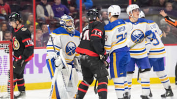 Nov 16, 2022; Ottawa, Ontario, CAN; Buffalo Sabres goalie Eric Comrie (31) makes a save in front of Ottawa Senators left wing Tyler Motte (14) in the first period at the Canadian Tire Centre. Mandatory Credit: Marc DesRosiers-USA TODAY Sports