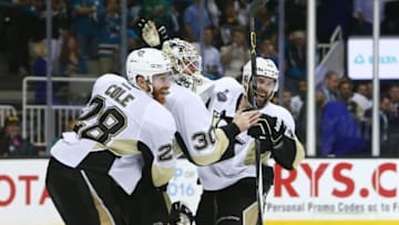 Jun 12, 2016; San Jose, CA, USA; Pittsburgh Penguins goalie Matt Murray (30) celebrates with defenseman Ben Lovejoy (12) and defenseman Ian Cole (28) after defeating the San Jose Sharks in game six of the 2016 Stanley Cup Final at SAP Center at San Jose. Mandatory Credit: Jerry Lai-USA TODAY Sports