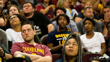 CLEVELAND, OH - JUNE 12: Cleveland Cavaliers fans react as they watch Game 5 of the NBA Finals between the Cleveland Cavaliers and the Golden State Warriors during a watch party at The Quicken Loans Arena on June 12, 2017 in Cleveland, Ohio. For the second year in a row Cleveland trailed Golden State 3-1 in the best of seven series but were defeated 129-120 in Game 5. (Photo by Angelo Merendino/Getty Images)