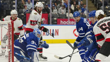 Sep 24, 2022; Toronto, Ontario, CAN; Toronto Maple Leafs goaltender Ilya Samsonov (35) makes a save as Ottawa Senators forward Angus Crookshank (59) and Toronto Maple Leafs forward Bobby McMann (74) and defenseman Mikko Kokkonen (84) close in during the first period at Scotiabank Arena. Mandatory Credit: John E. Sokolowski-USA TODAY Sports