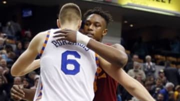 Feb 24, 2016; Indianapolis, IN, USA; New York Knicks center Kirstaps Porzingis (6) and Indiana Pacers center Myles Turner (33) hug after the game at Bankers Life Fieldhouse. Indiana defeats New York 108-105. Mandatory Credit: Brian Spurlock-USA TODAY Sports