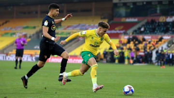 NORWICH, ENGLAND - APRIL 20: Max Aarons of Norwich City and Adam Masina of Watford during the Sky Bet Championship match between Norwich City and Watford at Carrow Road on April 20, 2021 in Norwich, England. Sporting stadiums around the UK remain under strict restrictions due to the Coronavirus Pandemic as Government social distancing laws prohibit fans inside venues resulting in games being played behind closed doors. (Photo by Stephen Pond/Getty Images)