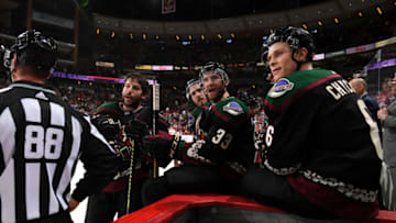 GLENDALE, ARIZONA - NOVEMBER 16: Jason Demers #55, Alex Goligoski #33, Jordan Oesterle #82 and Jakob Chychrun #6 of the Arizona Coyotes have a few words for the Calgary Flames bench during a stop in play at Gila River Arena on November 16, 2019 in Glendale, Arizona. (Photo by Norm Hall/NHLI via Getty Images)