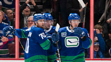 VANCOUVER, BC - JANUARY 18: Tanner Pearson #70 of the Vancouver Canucks celebrates with teammates Adam Gaudette #88 and Jake Virtanen #18 after scoring a goal against the San Jose Sharks in NHL action on January, 18, 2020 at Rogers Arena in Vancouver, British Columbia, Canada. (Photo by Rich Lam/Getty Images)