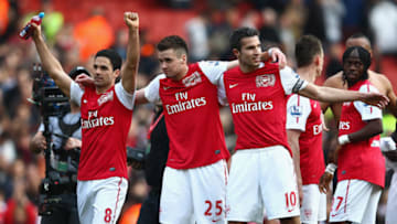 LONDON, ENGLAND - FEBRUARY 26: (L-R) Mikel Arteta, Carl Jenkinson and Robin van Persie of Arsenal celebrate after the Barclays Premier League match between Arsenal and Tottenham Hotspur at Emirates Stadium on February 26, 2012 in London, England. (Photo by Clive Mason/Getty Images)
