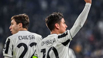 Juventus' Argentine forward Paulo Dybala (R) celebrates next to Juventus' Italian forward Federico Chiesa after scoring a penalty during the UEFA Champions League Group H football match between Juventus and Zenit on November 02, 2021 at the Juventus stadium in Turin. (Photo by Isabella BONOTTO / AFP) (Photo by ISABELLA BONOTTO/AFP via Getty Images)