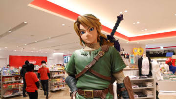 TOKYO, JAPAN - 2021/03/03: Link figurine from Legend of Zelda with shop staff inside Nintendo Tokyo store in Shibuya. (Photo by Stanislav Kogiku/SOPA Images/LightRocket via Getty Images)