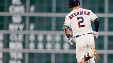 HOUSTON, TEXAS - MAY 28: Alex Bregman #2 of the Houston Astros hits a home run in the sixth inning against the Chicago Cubs at Minute Maid Park on May 28, 2019 in Houston, Texas. (Photo by Bob Levey/Getty Images)