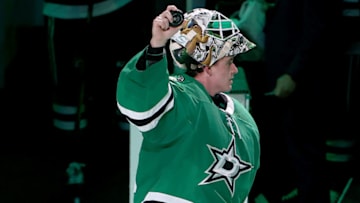 DALLAS, TEXAS - NOVEMBER 16: Jake Oettinger #29 of the Dallas Stars celebrates his first win after the Dallas Stars beat the Detroit Red Wings 5-2 at American Airlines Center on November 16, 2021 in Dallas, Texas. (Photo by Tom Pennington/Getty Images)