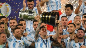 TOPSHOT - Argentina's Lionel Messi holds the trophy after winning the Conmebol 2021 Copa America football tournament final match against Brazil at Maracana Stadium in Rio de Janeiro, Brazil, on July 10, 2021. (Photo by NELSON ALMEIDA / AFP) (Photo by NELSON ALMEIDA/AFP via Getty Images)
