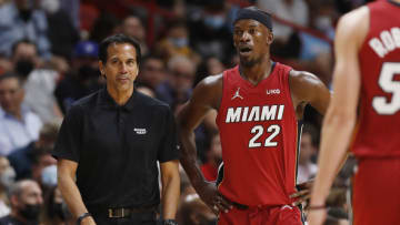 Head coach Erik Spoelstra of the Miami Heat talks with Jimmy Butler #22 against the Milwaukee Bucks (Photo by Michael Reaves/Getty Images)