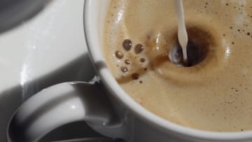 VIENNA, AUSTRIA - APRIL 26: Milk drops into a Melange at Cafe Central on April 26, 2012 in Vienna, Austria. Cafe Central, which opened its doors in 1876, is one of the many famous, traditional coffee houses in Vienna. UNESCO declared Viennese coffee houses and coffee culture an intangible heritage last year. (Photo by Mathias Kniepeiss/Getty Images)