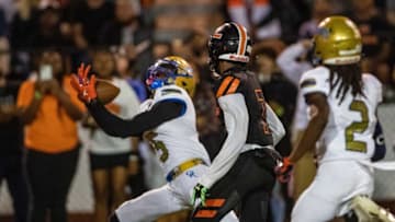 Osceola (5) Ja'keem Jackson almost intercepts a pass intended for Lakeland (7) Cormani McClain during first half action in Lakeland Fl Friday December 2,2022.Ernst Peters/The Ledger120222 Ep Preps 14 News