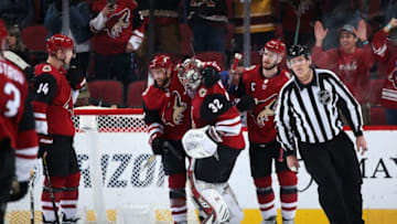 GLENDALE, ARIZONA - FEBRUARY 17: Goaltender Antti Raanta #32 of the Arizona Coyotes is congratulated by Alex Goligoski #33 after defeating the New York Islanders in the NHL game at Gila River Arena on February 17, 2020 in Glendale, Arizona. The Coyotes defeated the Islanders 2-1. (Photo by Christian Petersen/Getty Images)