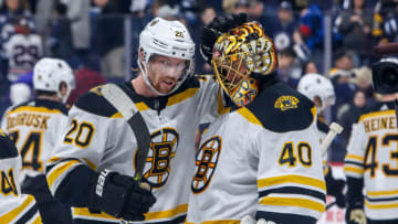 WINNIPEG, MB - JANUARY 31: Joakim Nordstrom #20 and goaltender Tuukka Rask #40 of the Boston Bruins celebrate a 2-1 victory over the Winnipeg Jets at the Bell MTS Place on January 31, 2020 in Winnipeg, Manitoba, Canada. (Photo by Jonathan Kozub/NHLI via Getty Images)