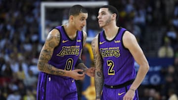 OAKLAND, CA - DECEMBER 25: Lonzo Ball #2 of the Los Angeles Lakers listens to teammate Kyle Kuzma #0 against the Golden State Warriors during the second half of their NBA Basketball game at ORACLE Arena on December 25, 2018 in Oakland, California. NOTE TO USER: User expressly acknowledges and agrees that, by downloading and or using this photograph, User is consenting to the terms and conditions of the Getty Images License Agreement. (Photo by Thearon W. Henderson/Getty Images)
