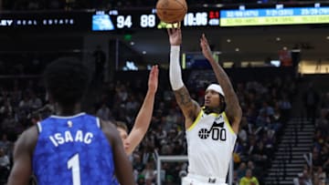 Nov 2, 2023; Salt Lake City, Utah, USA; Utah Jazz guard Jordan Clarkson (00) shoots a three point shot against the Orlando Magic during the fourth quarter at the Delta Center. Mandatory Credit: Rob Gray-USA TODAY Sports
