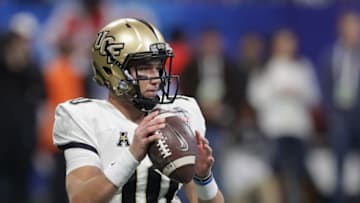 ATLANTA, GA - JANUARY 01: McKenzie Milton #10 of the UCF Knights looks to pass in the second half against the Auburn Tigers during the Chick-fil-A Peach Bowl at Mercedes-Benz Stadium on January 1, 2018 in Atlanta, Georgia. (Photo by Streeter Lecka/Getty Images)