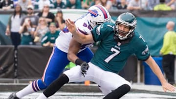 Dec 13, 2015; Philadelphia, PA, USA; Philadelphia Eagles quarterback Sam Bradford (7) is knocked down by Buffalo Bills defensive end Jerry Hughes (55) after throwing the ball during the second quarter at Lincoln Financial Field. Mandatory Credit: Bill Streicher-USA TODAY Sports