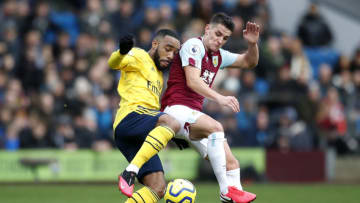 Arsenal's Alexandre Lacazette (left) and Burnley's Ashley Westwood battle for the ball during the Premier League match at Turf Moor, Burnley. (Photo by Martin Rickett/PA Images via Getty Images)