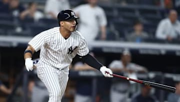 NEW YORK, NY - MAY 29: Gleyber Torres #25 of the New York Yankees hits a game winning RBI single in the tenth inning against the Houston Astros at Yankee Stadium on May 29, 2018 in New York City. (Photo by Al Bello/Getty Images)