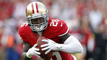 Oct 6, 2013; San Francisco, CA, USA; San Francisco 49ers defensive back Tramaine Brock (26) returns an interception for a touchdown against the Houston Texans in the first quarter at Candlestick Park. Mandatory Credit: Cary Edmondson-USA TODAY Sports