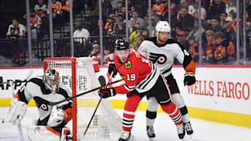 Jan 19, 2023; Philadelphia, Pennsylvania, USA; Chicago Blackhawks center Jonathan Toews (19) is defended by Philadelphia Flyers defenseman Cam York (45) during the second period at Wells Fargo Center. Mandatory Credit: Eric Hartline-USA TODAY Sports