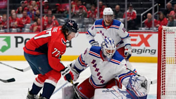 WASHINGTON, DC - OCTOBER 18: Henrik Lundqvist #30 of the New York Rangers makes a save against T.J. Oshie #77 of the Washington Capitals in the first period at Capital One Arena on October 18, 2019 in Washington, DC. (Photo by Patrick McDermott/NHLI via Getty Images)