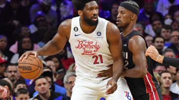 Apr 6, 2023; Philadelphia, Pennsylvania, USA; Philadelphia 76ers center Joel Embiid (21) is defended by Miami Heat forward Jimmy Butler (22) during the second quarter at Wells Fargo Center. Mandatory Credit: Eric Hartline-USA TODAY Sports