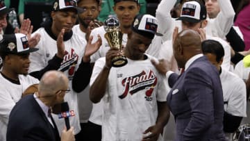 May 29, 2023; Boston, Massachusetts, USA; Miami Heat forward Jimmy Butler (22) celebrates with the MVP trophy after the Heat defeated the Boston Celtics in game seven of the Eastern Conference Finals for the 2023 NBA playoffs at TD Garden. Mandatory Credit: Winslow Townson-USA TODAY Sports