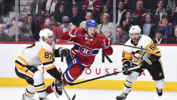 MONTREAL, QC - OCTOBER 13: Jonathan Drouin #92 of the Montreal Canadiens tries to skate past Sidney Crosby #87 and Kris Letang #58 of the Pittsburgh Penguins during the NHL game at the Bell Centre on October 13, 2018 in Montreal, Quebec, Canada. The Montreal Canadiens defeated the Pittsburgh Penguins 4-3 in a shootout. (Photo by Minas Panagiotakis/Getty Images)