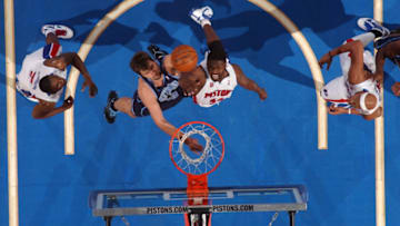 AUBURN HILLS, MI - MARCH 10: Mehmet Okur #13 of the Utah Jazz goes up for a rebound against Jason Maxiell #54 of the Detroit Pistons in a game at the Palace of Auburn Hills on March 10, 2010 in Auburn Hills, Michigan. Copyright 2010 NBAE (Photo by Allen Einstein/NBAE via Getty Images)