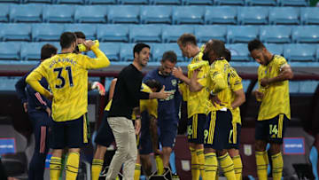 BIRMINGHAM, ENGLAND - JULY 21: Mikel Arteta the head coach / manager of Arsenal talks to his team during a water break during the Premier League match between Aston Villa and Arsenal FC at Villa Park on July 21, 2020 in Birmingham, United Kingdom. Football Stadiums around Europe remain empty due to the Coronavirus Pandemic as Government social distancing laws prohibit fans inside venues resulting in all fixtures being played behind closed doors. (Photo by Matthew Ashton - AMA/Getty Images)