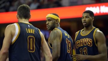 Oct 30, 2014; Cleveland, OH, USA; Cleveland Cavaliers forward LeBron James (23) talks with forward Kevin Love (0) and forward Tristan Thompson (13) against the New York Knicks at Quicken Loans Arena. New York won 95-90. Mandatory Credit: David Richard-USA TODAY Sports