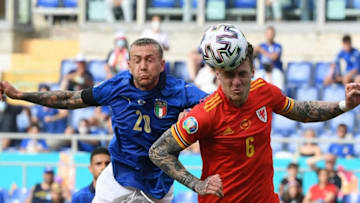 Wales' defender Joe Rodon (R) vies for the ball with Italy's midfielder Federico Bernardeschi during the UEFA EURO 2020 Group A football match between Italy and Wales at the Olympic Stadium in Rome on June 20, 2021. (Photo by ALBERTO LINGRIA / POOL / AFP) (Photo by ALBERTO LINGRIA/POOL/AFP via Getty Images)