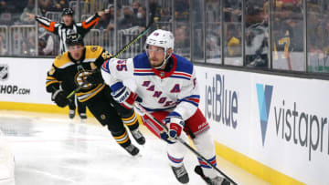 BOSTON, MASSACHUSETTS - OCTOBER 02: Ryan Lindgren #55 of the New York Rangers skates past Brad Marchand #63 of the Boston Bruins during the third period of the preseason game at TD Garden on October 02, 2021 in Boston, Massachusetts. (Photo by Maddie Meyer/Getty Images)
