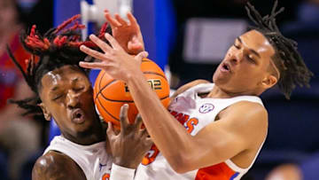 Florida Gators forward CJ Felder (1) and Florida Gators guard Will Richard (5) battle for control of a rebound. The Florida Gators menÕs basketball team hosted the Florida Atlantic Owls at Billy Donovan Court at Exactech Arena in Gainesville, FL on Monday, November 14, 2022. The score was tied 35-35 at the half. [Doug Engle/Gainesville Sun]Gai Ufbasketballfau